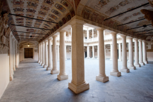 A historical building with columns and arches