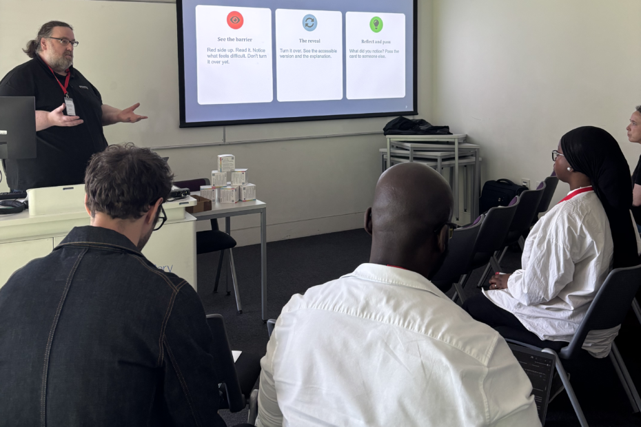 Gavin Henrick, CEO and co-founder of Brickfield Education Labs, presenting to a group of participants, with a slide titled 'How this format works' displayed on the screen behind him.